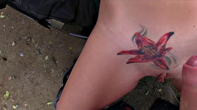 Tattooed brunette trades lift for quick fuck in public car action