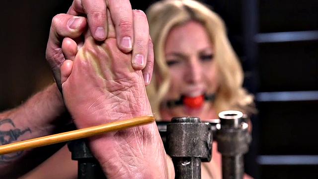 Blonde teen with tattoos gets her pussy and feet whipped during casting session