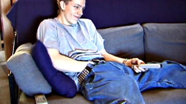 Shane relaxes on the sofa, while watching a porn video and gets totally into himself. He works his lubed up cock with determination and pumps out a big cum gusher.