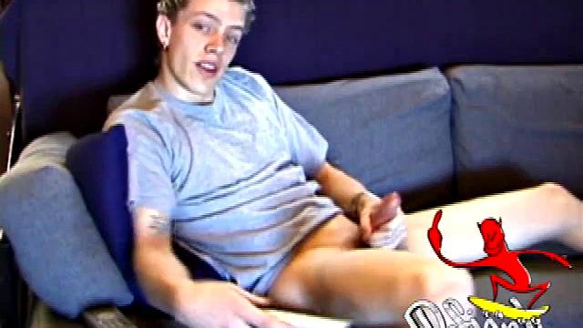 Shane relaxes on the sofa, while watching a porn video and gets totally into himself. He works his lubed up cock with determination and pumps out a big cum gusher.