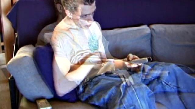 Shane relaxes on the sofa, while watching a porn video and gets totally into himself. He works his lubed up cock with determination and pumps out a big cum gusher.
