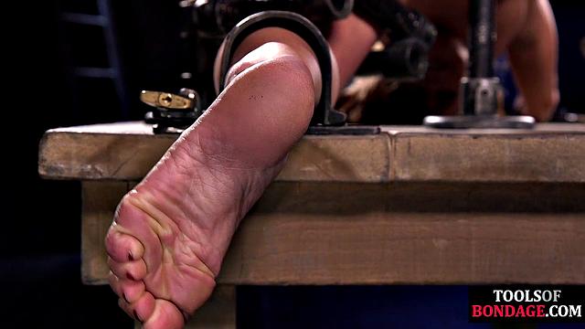 Submissive suspended in dungeon