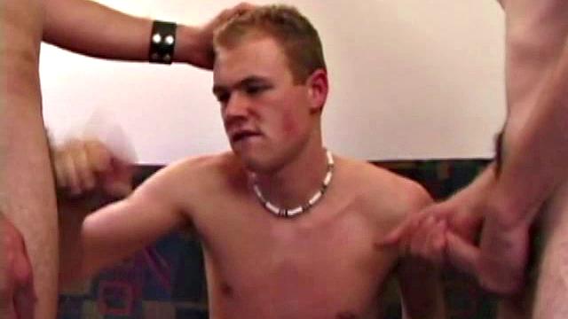 Elijah, Brett and Nate take turns sucking each other's, before Nate stands up and splatters his cum all over Brett's lips and chin.