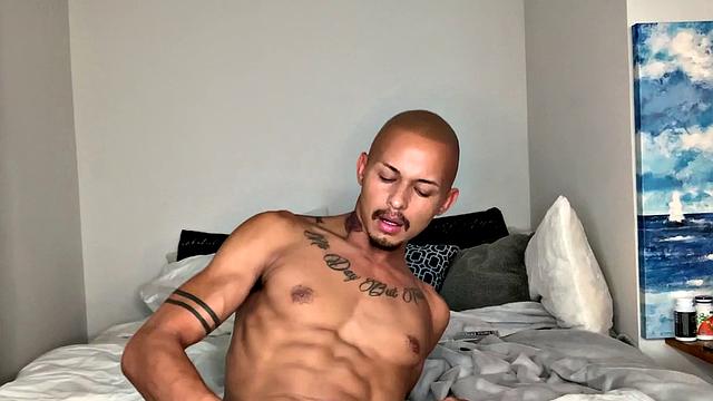 Parked on his bed, Joseph slowly starts stripping out of his clothes. Down to his boxers, he pulls out his huge cock and balls, and begins working up a stiff one. Once hard, the young Latino gets completely naked and starts beating off.