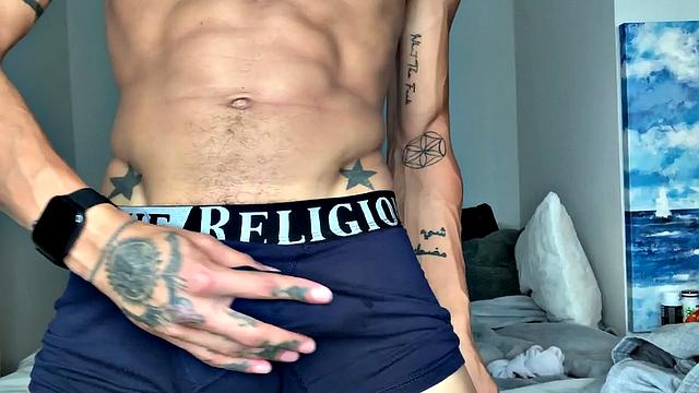 Parked on his bed, Joseph slowly starts stripping out of his clothes. Down to his boxers, he pulls out his huge cock and balls, and begins working up a stiff one. Once hard, the young Latino gets completely naked and starts beating off.