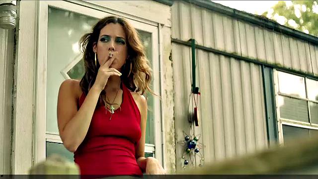 Riley Keough striptease