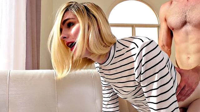 Small-breasted blonde tgirl in heels bred from behind