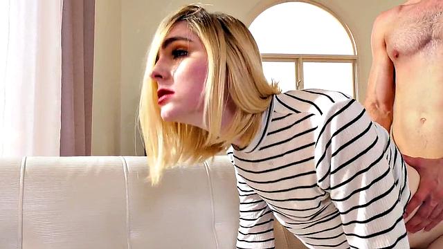 Small-breasted blonde tgirl in heels bred from behind