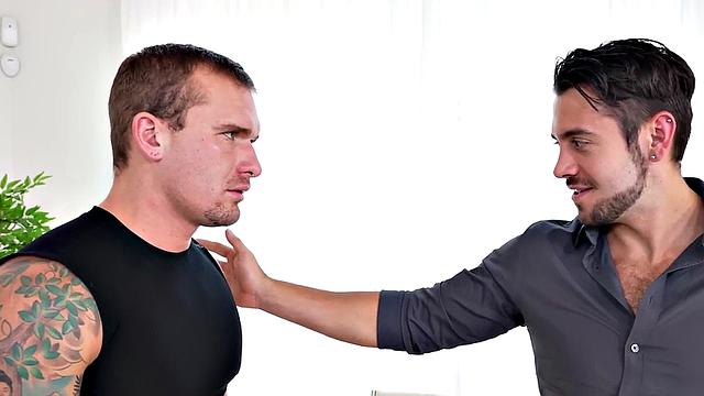 Mesmerized tattooed jock deepthroating cock