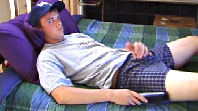 Sweet young Connor comes ready to jerk off. He lies down, sticks his hands in his pants and works up a stiffy. Soon his mushroom head cock bursts forth its cum load, all over his stomach.