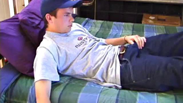 Sweet young Connor comes ready to jerk off. He lies down, sticks his hands in his pants and works up a stiffy. Soon his mushroom head cock bursts forth its cum load, all over his stomach.