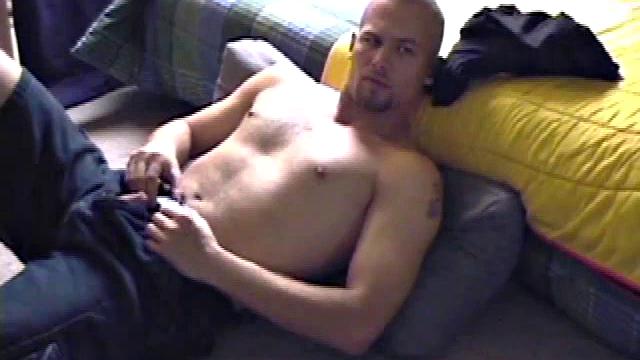 Stephen starts by unzipping and pulling out his cock to get hard. Stripped naked, he lays on his back, lubes up, and gets down to some serious stroking. Switching hands, he tightens his grip and cums like a sprinkler all over his chest.