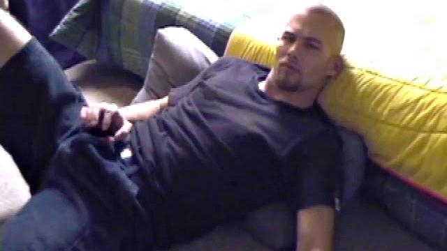 Stephen starts by unzipping and pulling out his cock to get hard. Stripped naked, he lays on his back, lubes up, and gets down to some serious stroking. Switching hands, he tightens his grip and cums like a sprinkler all over his chest.