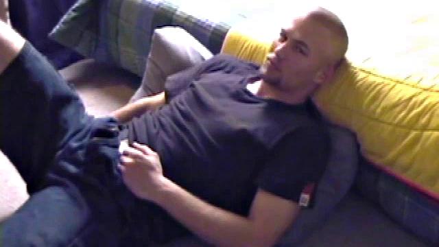 Stephen starts by unzipping and pulling out his cock to get hard. Stripped naked, he lays on his back, lubes up, and gets down to some serious stroking. Switching hands, he tightens his grip and cums like a sprinkler all over his chest.