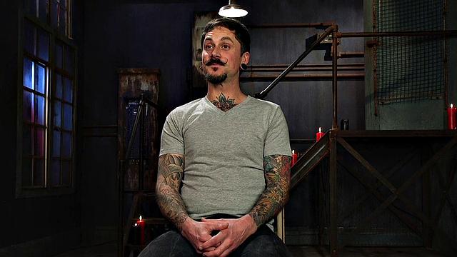 Dungeon dominatrix restrains and pegs