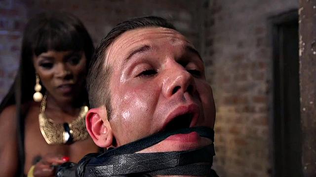 Ebony dominatrix whips and pegs sub