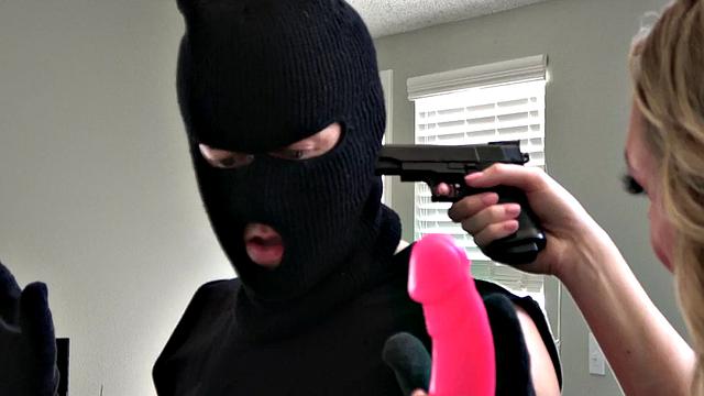 Strapon mistress shows dominance to uninvited guest