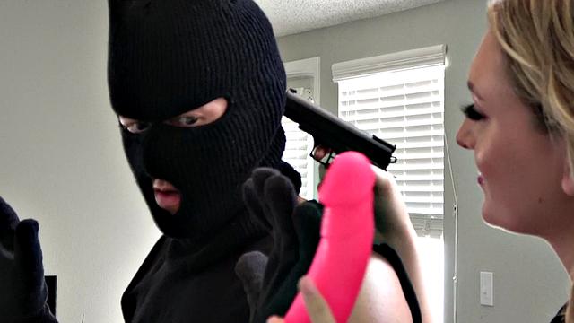 Strapon mistress shows dominance to uninvited guest