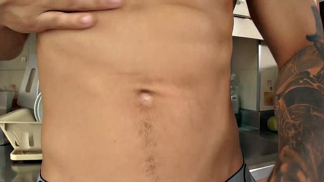 We find Julian in the kitchen, as his clothes slowly hit the floor. He pushes his pants and underwear down and a big boner pops out. Once Julian is completely naked, he leans against a counter and starts jacking off.