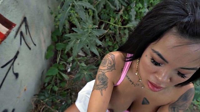 Tattooed public slut fucked outdoors in doggystyle