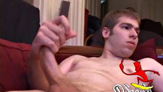Adam Turner strips naked and grabs the lube, as he checks out a video that's playing. He works himself stiff and strokes with determination, until his cum starts pumping.