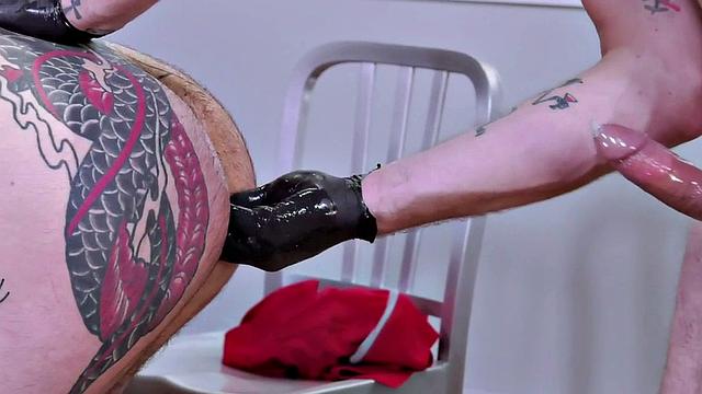 Hunky inked bottom anally fisted by stud