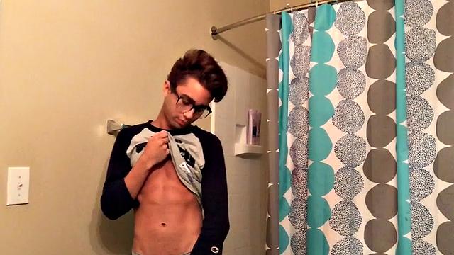 Skinny and smooth twink Gerald is in the bathroom to jerk off, and by the time this boy is naked he's sporting a monster uncut boner