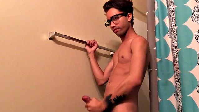 Skinny and smooth twink Gerald is in the bathroom to jerk off, and by the time this boy is naked he's sporting a monster uncut boner