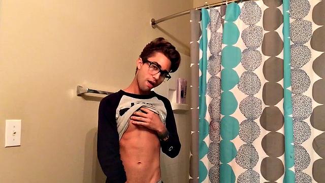 Skinny and smooth twink Gerald is in the bathroom to jerk off, and by the time this boy is naked he's sporting a monster uncut boner