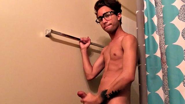 Skinny and smooth twink Gerald is in the bathroom to jerk off, and by the time this boy is naked he's sporting a monster uncut boner