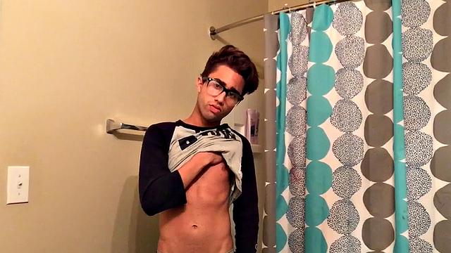 Skinny and smooth twink Gerald is in the bathroom to jerk off, and by the time this boy is naked he's sporting a monster uncut boner