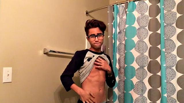 Skinny and smooth twink Gerald is in the bathroom to jerk off, and by the time this boy is naked he's sporting a monster uncut boner