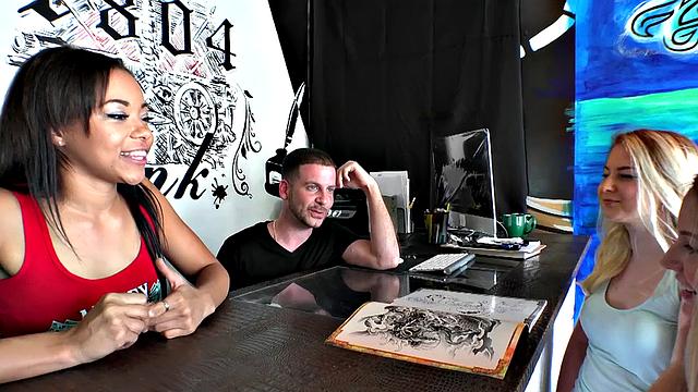 Brunette with tattoos fucks in public, getting her bald pussy pounded and taking a cumshot