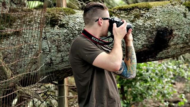 Tattooed jock rides dildo during solo action