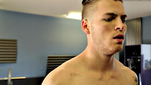 Tattooed jock rides dildo during solo action