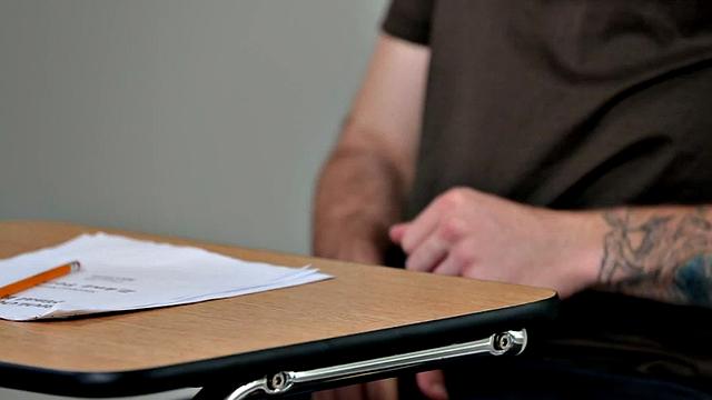 Tattooed jock rides dildo during solo action