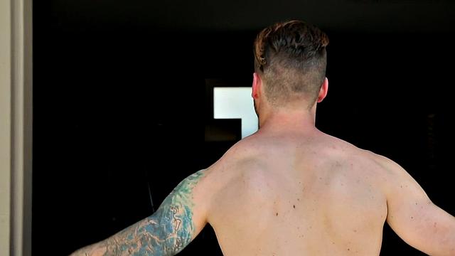 Tattooed jock rides dildo during solo action