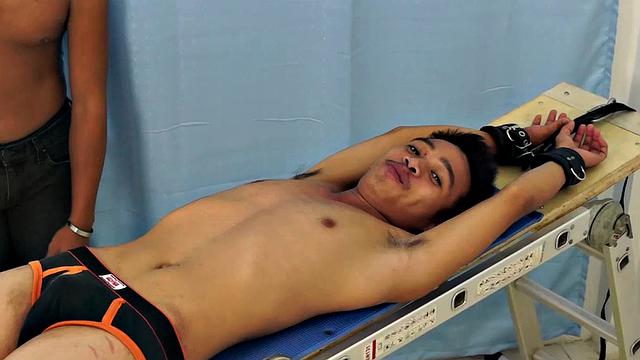 Introducing cute and ticklish Asian twink Jojo. This is his first shoot with Laughing Asians. Our long haired Asian boy Hunter is the sadistic tickler who has strapped Jojo on the tickle rack and puts him through his first tickle experience.