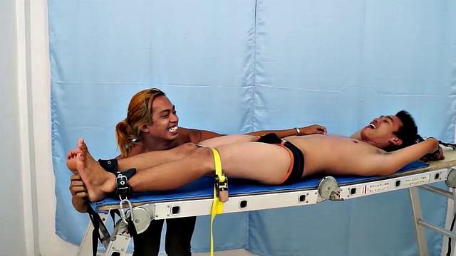 Introducing cute and ticklish Asian twink Jojo. This is his first shoot with Laughing Asians. Our long haired Asian boy Hunter is the sadistic tickler who has strapped Jojo on the tickle rack and puts him through his first tickle experience.