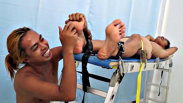 Introducing cute and ticklish Asian twink Jojo. This is his first shoot with Laughing Asians. Our long haired Asian boy Hunter is the sadistic tickler who has strapped Jojo on the tickle rack and puts him through his first tickle experience.