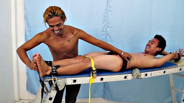 Introducing cute and ticklish Asian twink Jojo. This is his first shoot with Laughing Asians. Our long haired Asian boy Hunter is the sadistic tickler who has strapped Jojo on the tickle rack and puts him through his first tickle experience.