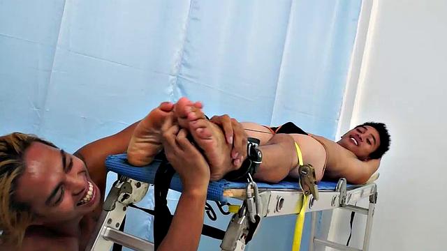 Introducing cute and ticklish Asian twink Jojo. This is his first shoot with Laughing Asians. Our long haired Asian boy Hunter is the sadistic tickler who has strapped Jojo on the tickle rack and puts him through his first tickle experience.