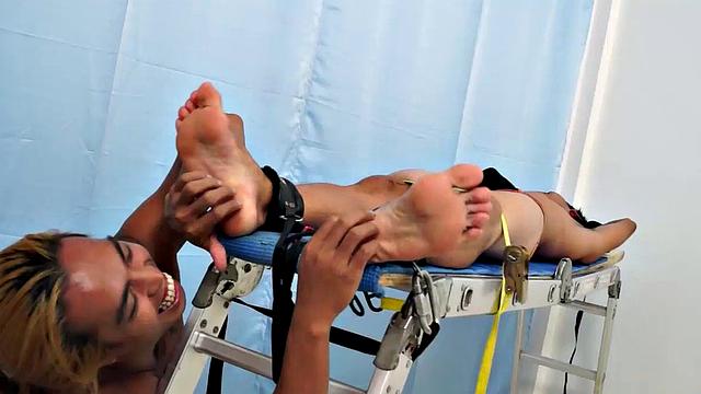 Introducing cute and ticklish Asian twink Jojo. This is his first shoot with Laughing Asians. Our long haired Asian boy Hunter is the sadistic tickler who has strapped Jojo on the tickle rack and puts him through his first tickle experience.