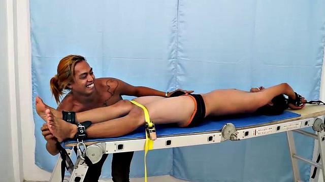 Introducing cute and ticklish Asian twink Jojo. This is his first shoot with Laughing Asians. Our long haired Asian boy Hunter is the sadistic tickler who has strapped Jojo on the tickle rack and puts him through his first tickle experience.