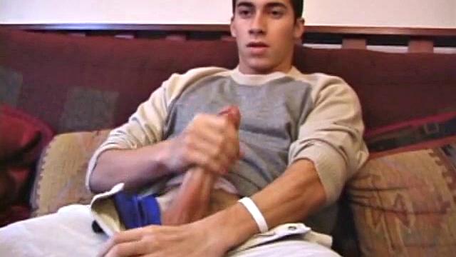 Levi Davis starts watching a porn video and pulls a monster cock out of his pants. A good stroking on his rock hard dick produces a creamy cum load in his hands.