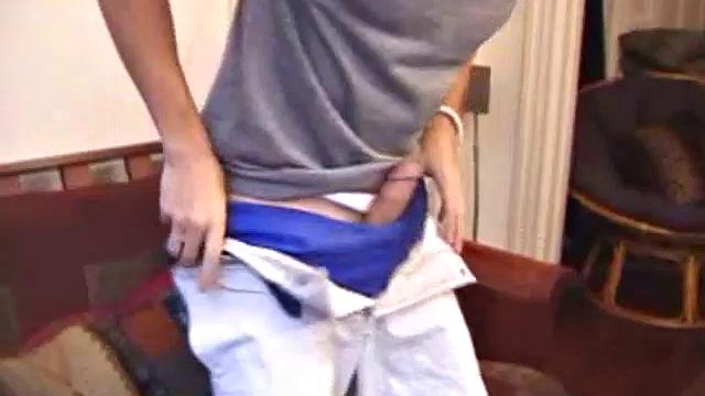 Levi Davis starts watching a porn video and pulls a monster cock out of his pants. A good stroking on his rock hard dick produces a creamy cum load in his hands.