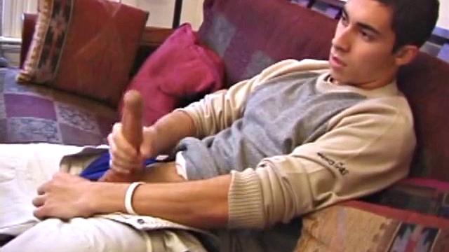 Levi Davis starts watching a porn video and pulls a monster cock out of his pants. A good stroking on his rock hard dick produces a creamy cum load in his hands.