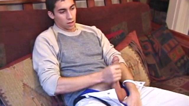 Levi Davis starts watching a porn video and pulls a monster cock out of his pants. A good stroking on his rock hard dick produces a creamy cum load in his hands.