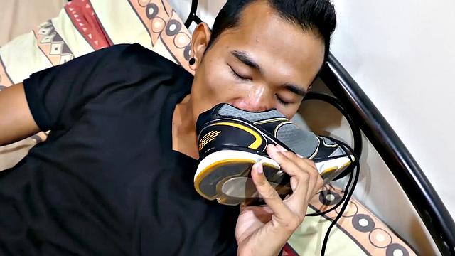 Joshua is a kinky Asian boy, who gets off on male feet. He just got home from a long day at work, and nothing turns him on more than the sweet aroma of feet that have spent all day penned up in his shoes.