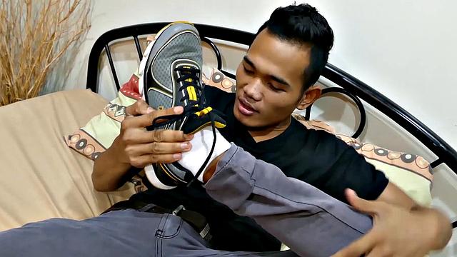 Joshua is a kinky Asian boy, who gets off on male feet. He just got home from a long day at work, and nothing turns him on more than the sweet aroma of feet that have spent all day penned up in his shoes.